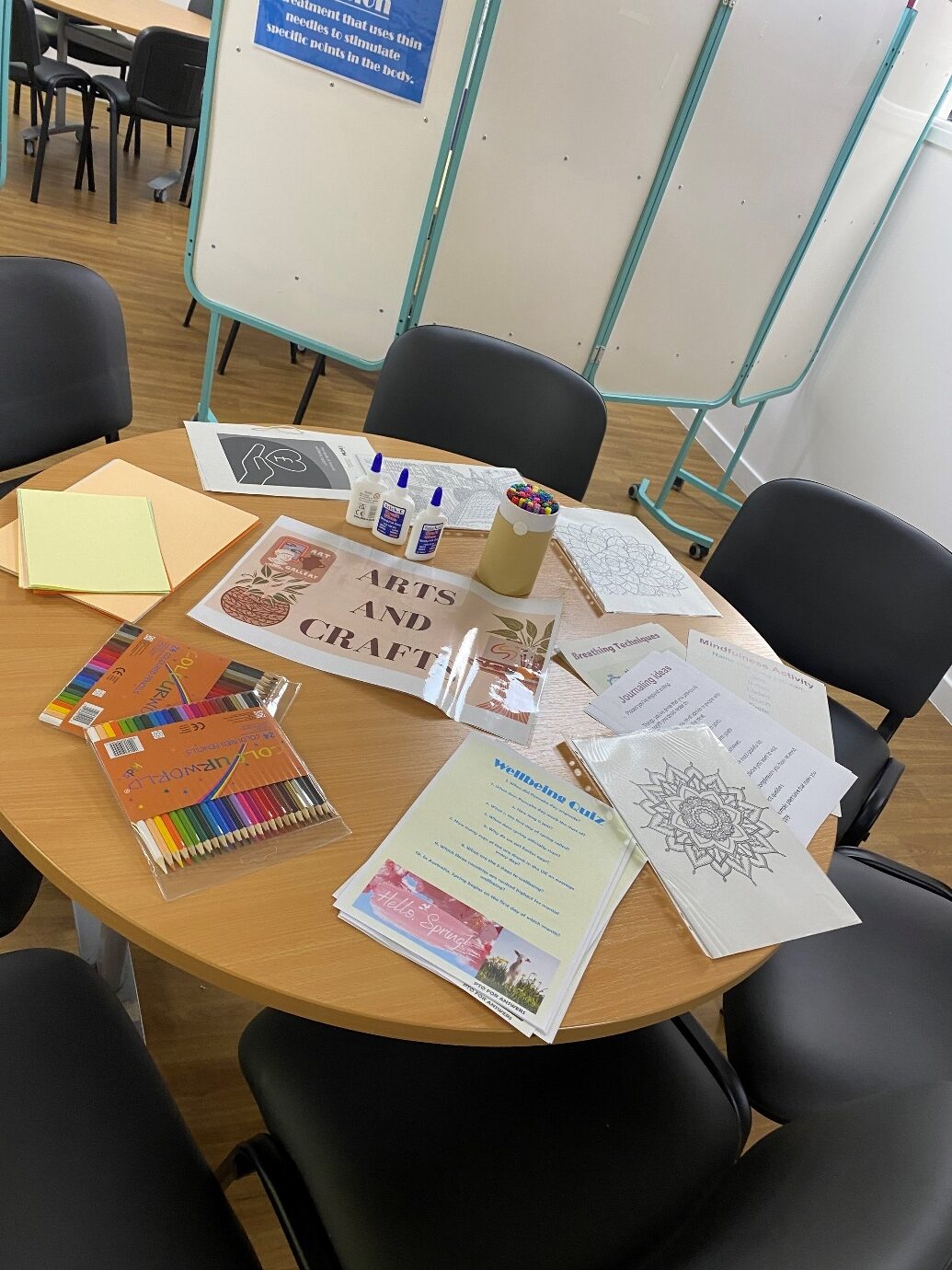 table with wellbeing arts and crafts